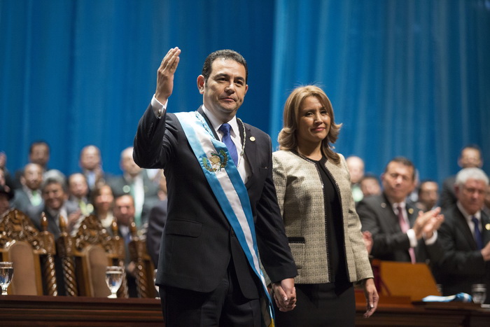 Guatemalan new President Jimmy Morales (L) waves next to his wife Hilda Marroquin during his inauguration ceremony in Guatemala City, on January 14, 2016. Morales, a former TV comic elected Guatemala's new president on a wave of public revulsion against widespread graft, took office in a ceremony attended by leaders from the Americas. AFP PHOTO / Luis ECHEVERRIA / AFP / LUIS ECHEVERRIA