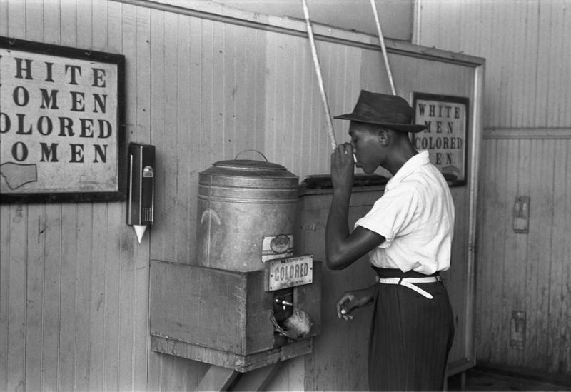 Colored _drinking_fountain_from_mid-20th_century_with_african-american_drinking-FotoRussellLee-LibraryofCongress-1939_resize